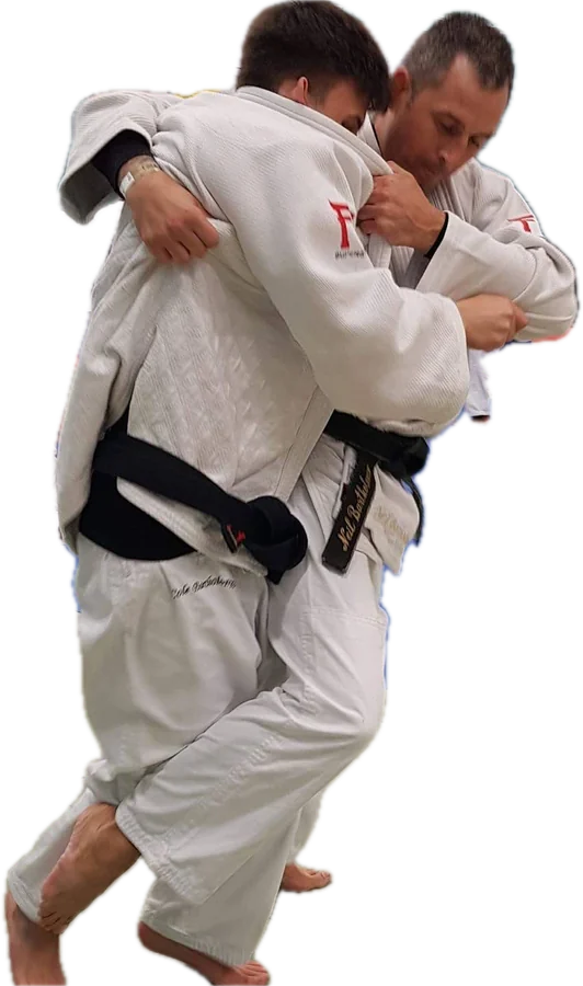 Two judoka in white gi gripping in randori